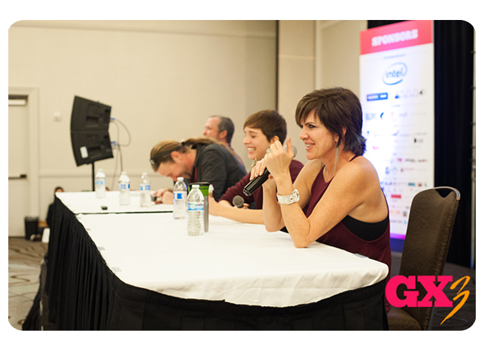 People speaking at a panel
